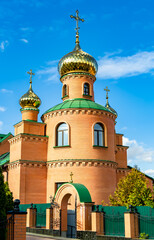 Christian church cross in high steeple tower for prayer
