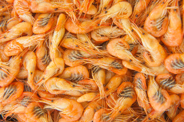 Cooked shrimps food background, top view