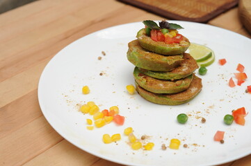 Vegetable fritters of zucchini served on a plate
