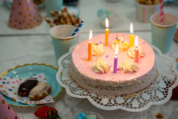 Cake, Candy, Marshmallows, Fruits and Berries, Chocolates, Waffles and other Sweets on Dessert Table at Kids Birthday Party