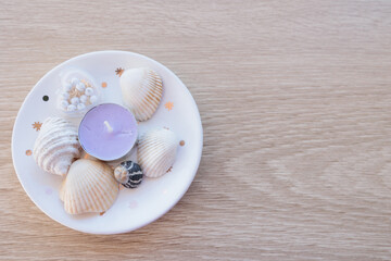 貝殻とキャンドルとアイボリー色の文字スペース