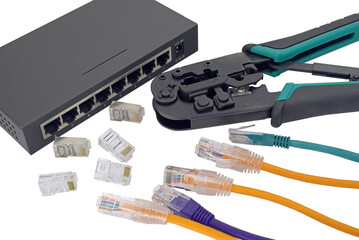 Network switch, ethernet cable, crimper isolated on white