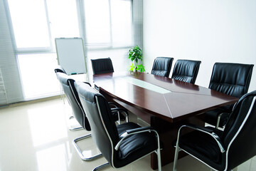 Empty conference room with table and chairs