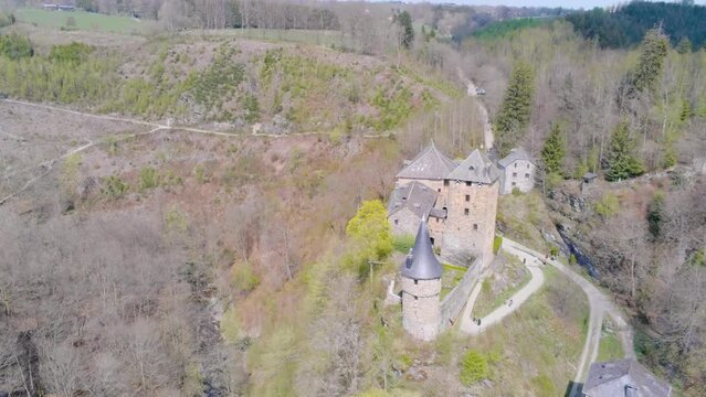 Tourists visiting Reinhardstein Castle in the Belgian Ardennes. The highest positioned castle of Belgium. Aerial pan shot