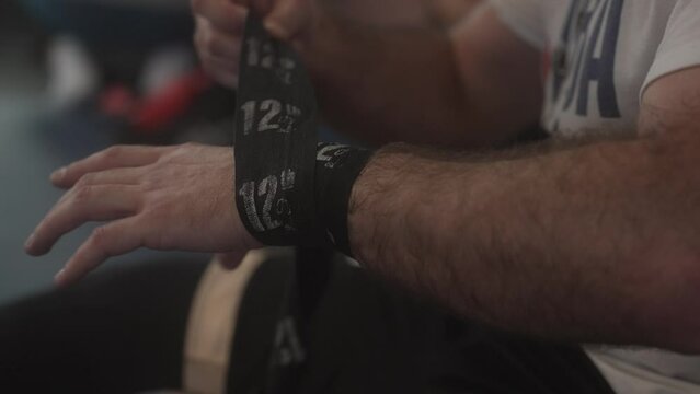 wraping hands and preparing for boxing training in slowmotion