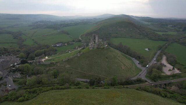 Late afternoon Corfe castle Dorset English Medieval Castle ruin drone aerial view