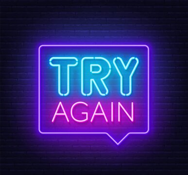 Try again neon sign on a brick background.