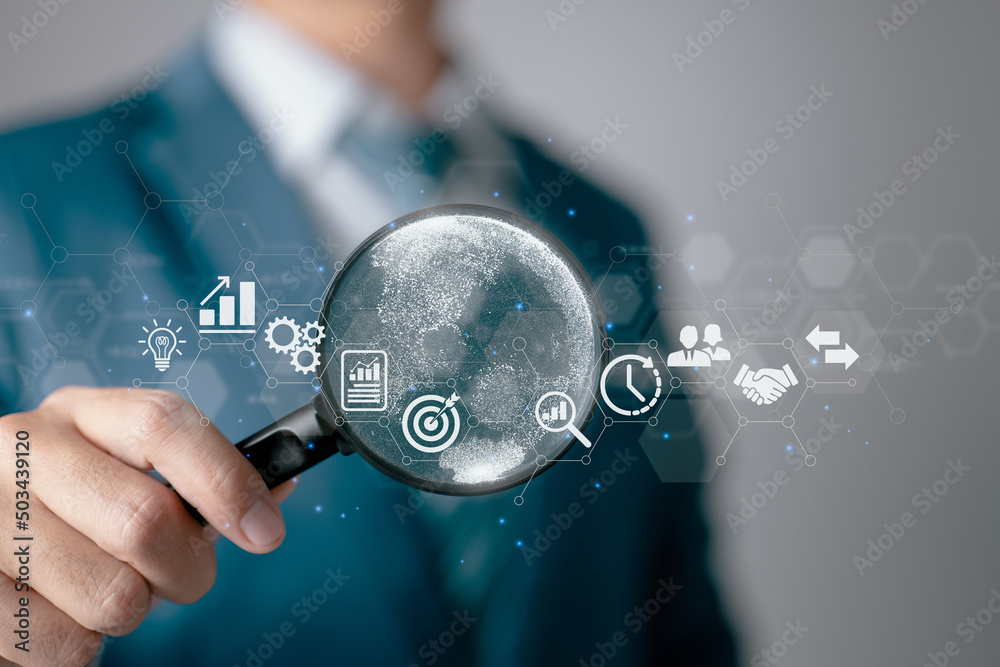 Aufkleber A businessman using a magnifying glass. Business global internet connection application technology and digital marketing, finance and banking, digital link technology, and big data.