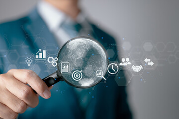 A businessman using a magnifying glass. Business global internet connection application technology...