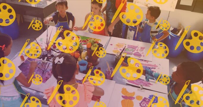 Animation of icons over diverse schoolchildren painting