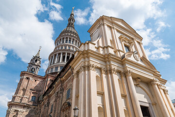 Historic center of Novara city, Italy. Novara, street Ferrari (via Ferrari) with basilica of San Gaudenzio (16th - 19th century) with the dome 121 meters high. Piedmont region