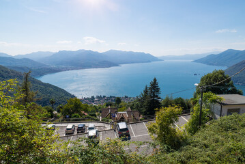 Fototapeta na wymiar Big Italian lake. Lake Maggiore, aerial view from Campagnano above Maccagno town (visible below). The Lombard and Piedmontese coasts are visible from Luino (on the left) to Stresa (on the horizon)