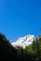 Caucasus Mountains Under Snow And Clear Blue Sky