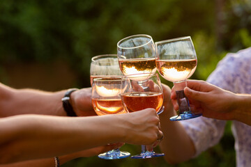 Party with a bottle of champagne. Sparkling at a bottle party. Sparkling pours into a glass. Holiday. A group of friends are having a rest with alcohol. Day off with alcohol. Party concept. Relax with