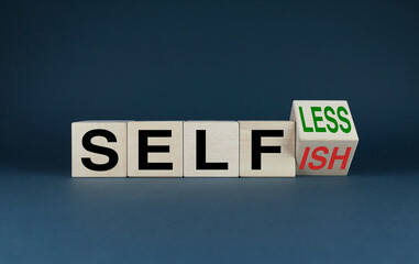 Cubes form the words Selfless or Selfish. Behavior and lifestyle concept