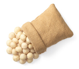 Shelled Macadamia nuts in the sack, isolated on white background, top view.