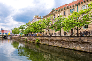 Fototapeta na wymiar A river channel in a European city. Great sunny day for walking