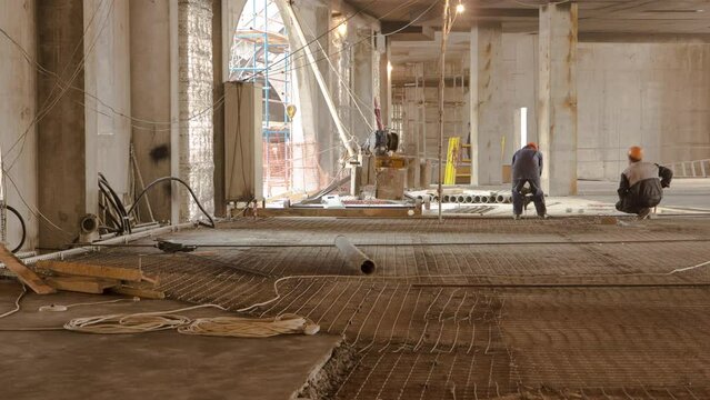 Construction works with circular abrasive cutoff saw angle grinding machine and sparkles timelapse. Construction site inside a building