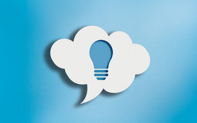 Bulb Icon in White Cloud Speech Bubble on Blue