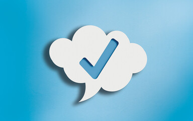 Check Mark Icon in White Cloud Speech Bubble on Blue