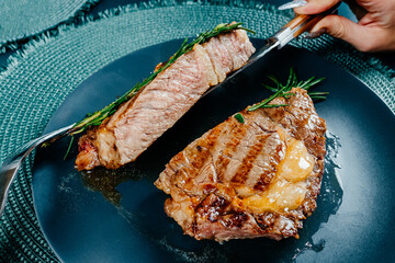 cooked steak on a blue plate