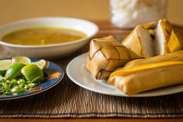 Rice cake (Ketupat) is Cooked Rice packed inside a diamond-shaped container of woven palm leaf pouch for Moslem Celebration. Eid Mubarak concept. Indonesian traditional food.