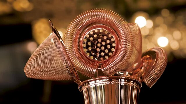 bartender's tool for making cocktails. jigger, shaker, strainer, bar spoon and more. beautiful tool for the job. close-up
