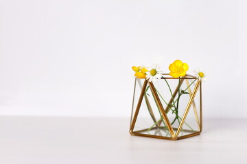 Glass and metal flower vase, on white, copy space