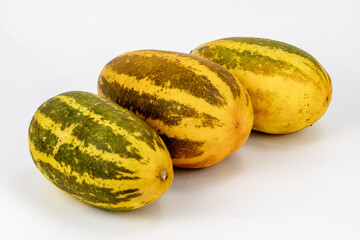 Vellery  Trichosanthes dioica, also known as pointed gourd, Vegetable, Orange and Green stripes, healthy food, isolated in white background, 3 pieces, studio lighting