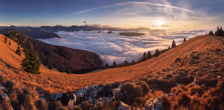 Morning sun panorama, beautiful fluffy clouds and forest at mount Lysec in Slovakia