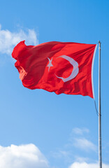 Turkish flag waving in the blue sky, flagpole, 