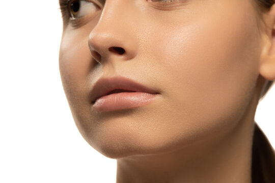 Cropped portrait of beautiful young girl with clean, well kept skin. Concept of cosmetics, makeup, natural and eco treatment, skin care.