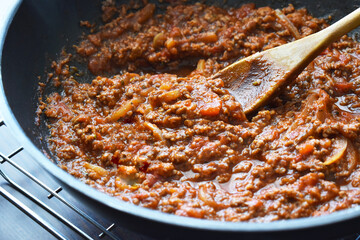 Bolognese sauce in a wok.  Traditional Italian food. 