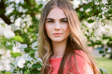 Beautiful young woman in summer garden. Beauty summertime. Film photography