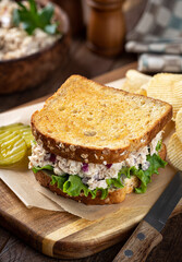 Tuna salad and lettuce sandwich on whole grain bread