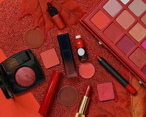 Makeup professional cosmetics in red glamour color, decorative and luxury cosmetics on red glittery background. Flat lay image