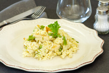 chicken and green asparagus risotto on a plate