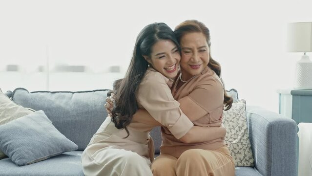 beautiful daughter asian hugging mother in family moment celebrate mother day.