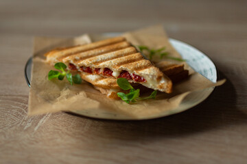 Sandwich with cheese tomatoes and greenary. Fast homemade delicious food