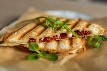 Sandwich with cheese tomatoes and greenary. Fast homemade delicious food