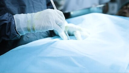 close up shot surgeon hands cutting skin of patient using scalpel at hospital theatre - concept of medical treatment
