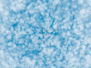 Abstract blurred glitter on baby blue light effects background. Ideal for card,wallpaper,background etc., 