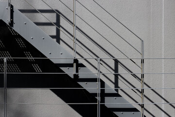 Steel staircase outside a wall