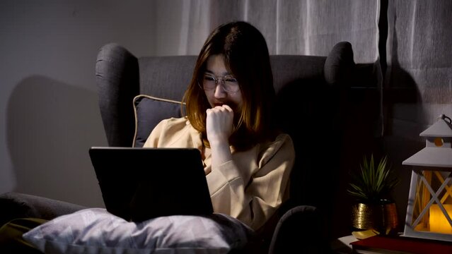 Asian Woman Watching Movie On Tablet At The Night At Home. Relax And Recreation Lifestyle.