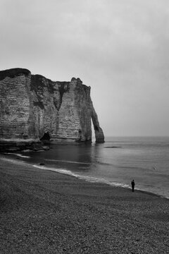 Etretat beach, single man, France, Normandyblack and white photography