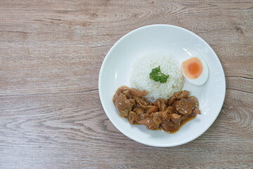 stir fried chicken with Teriyaki Japanese sauce on rice in plate with boiled egg