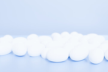 3d render of white pills for your project on a blue background
