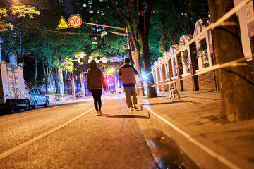 SHANGHAI, CHINA - APRIL 26, 2022: A couple walked their dog in lockdown after their compound was categorized as 