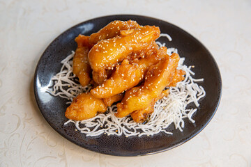 Fried honey chicken with sesame of traditional Cantonese yum-cha Asian gourmet cuisine meal food...