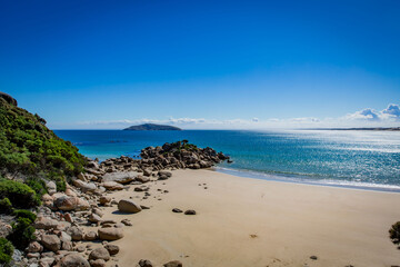 Fototapeta na wymiar Fairy Cove secret haven coast beach at Wilson Promontory Victoria Australia, with blue sky, sea rocks and blue green water